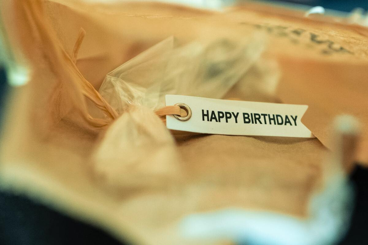 Happy birthday message attached to top of gift