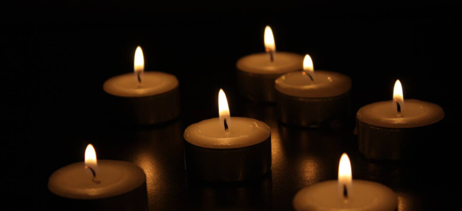 Lit church candles in memory of a person passed