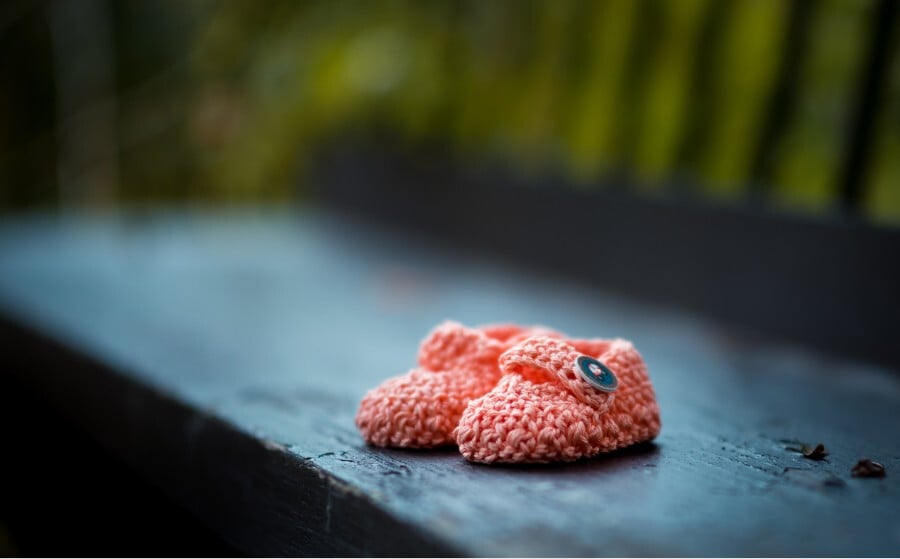 New baby shoes to represent a maternity leave card - a forthcoming birth
