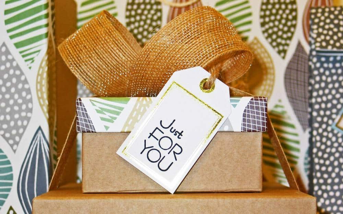 A wrapped gift with a Just for you card as a personalised celebration