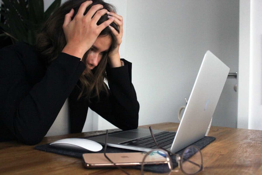 Female getting frustrated with laptop working from home