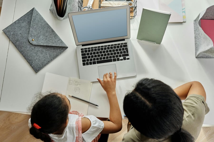 Mother Helping her Daughter with her Homework