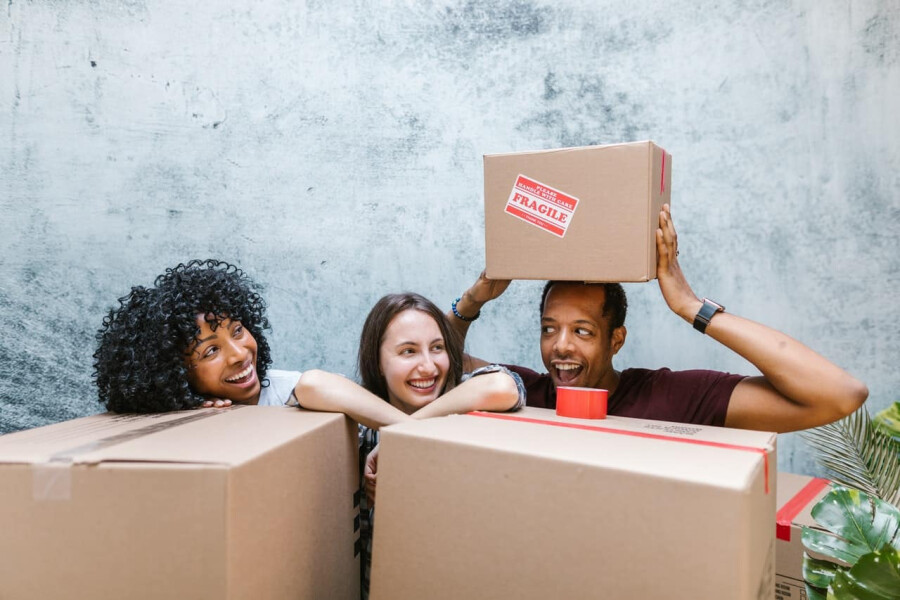 Image of a couple among packing boxes in their new home