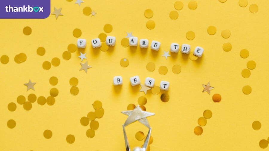 Sign spelling You Are The Best with confetti background