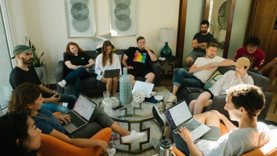 Group of people discussing projects in a shared space
