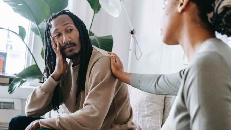 Woman showing empathy to a concerned man
