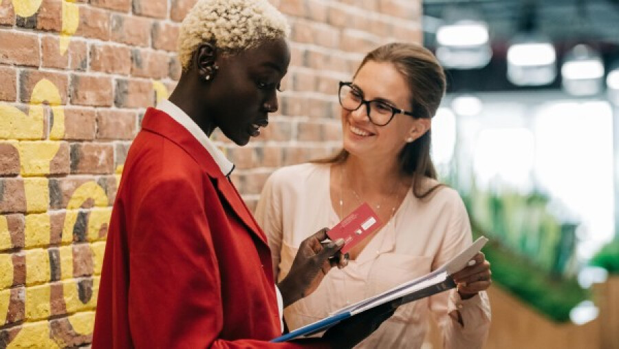 Multiethnic businesswomen discussing payments