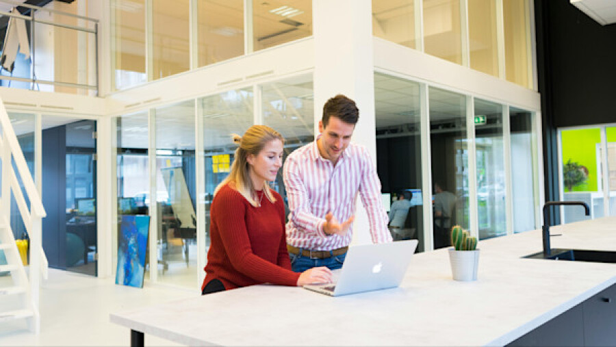 Man and woman using a laptop