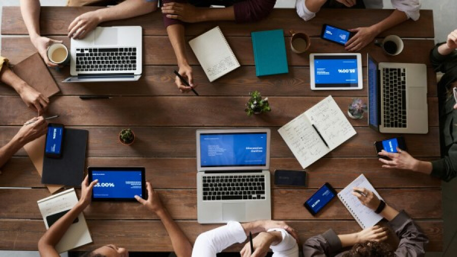 Top view of people working on a table