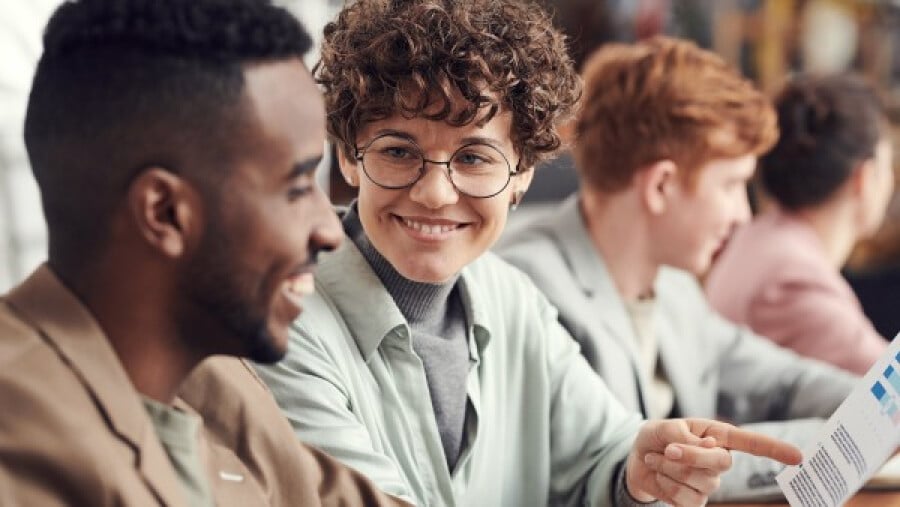 Smiling woman looking at a man