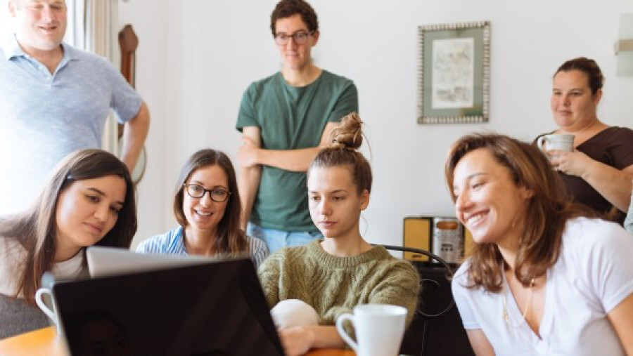 People looking at a laptop