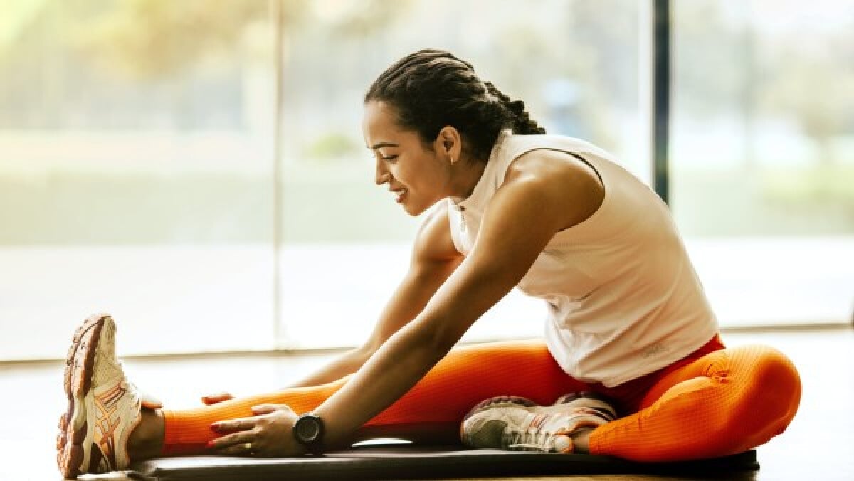 Woman stretching on the ground