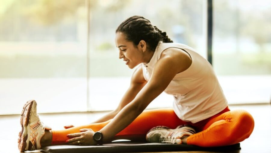 Woman stretching on the ground