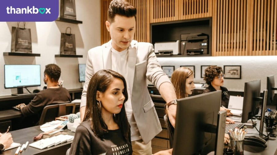 Man pointing at a monitor