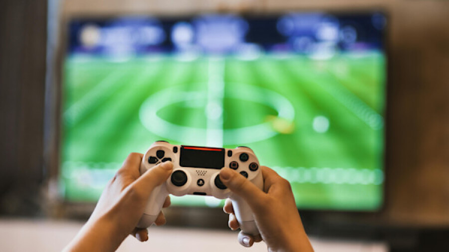 Person holding a game controller