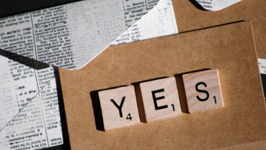 Wooden scrabble tiles spelling Yes