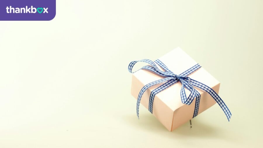 Box with a blue and white ribbon