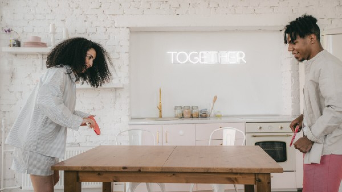 Man and a woman playing ping pong