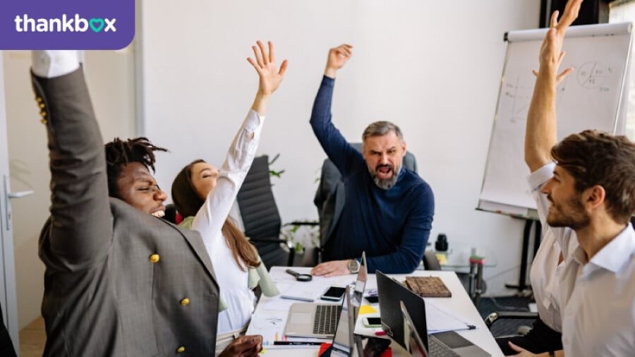 Team celebrating in an office