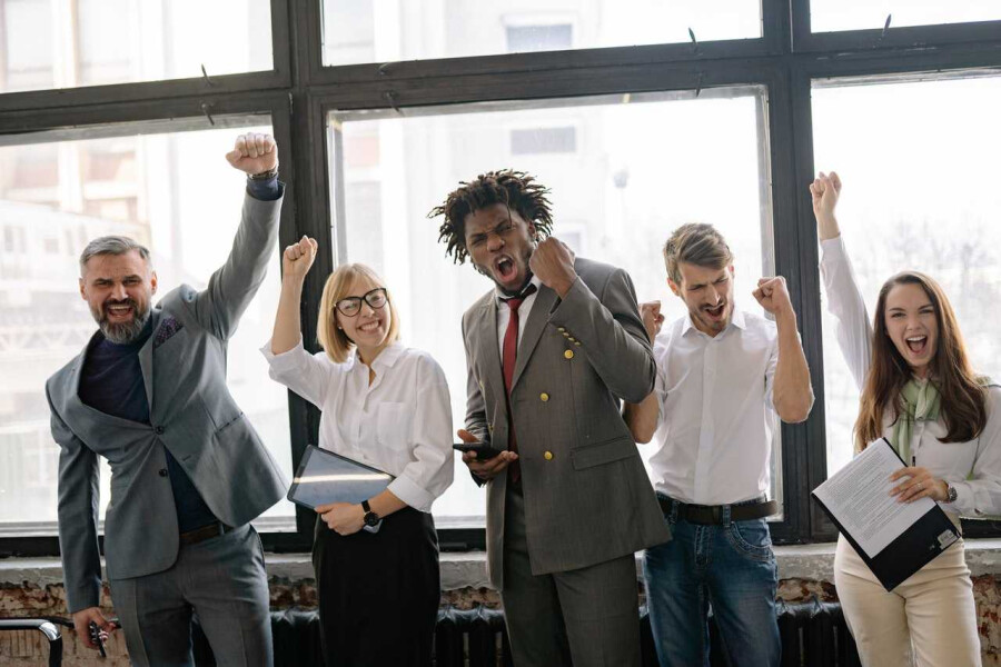 co-workers celebrating a colleague on their work anniversary
