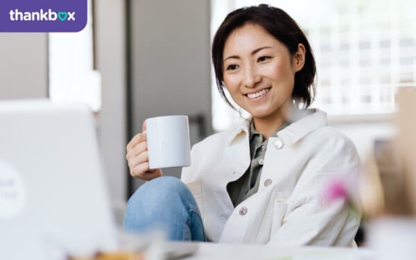 Teacher smiling at screen